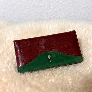 Leather checkbook brown black wallet silver golf ball.